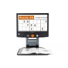 Image of the Reveal 16 magnifying a Kakuro number puzzle in a magazine.
